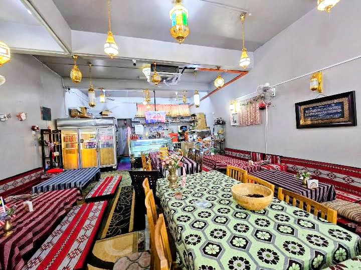 Interior of Restoran Jabal Dahlia with lanterns and traditional Arabic majlis seating